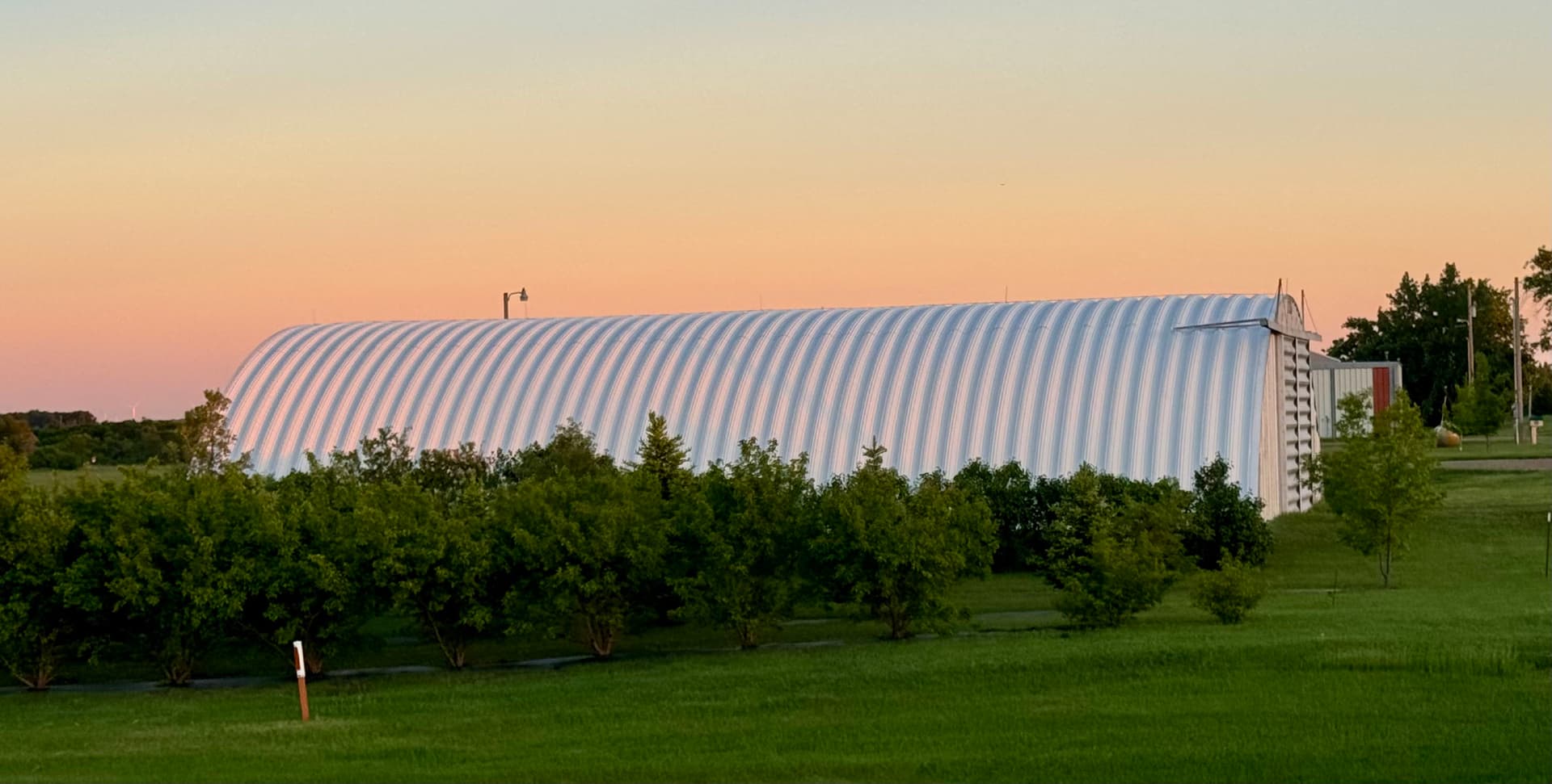 Quonset Metal Roof Restoration with Rust-Inhibiting Primer and Fluid Coating image